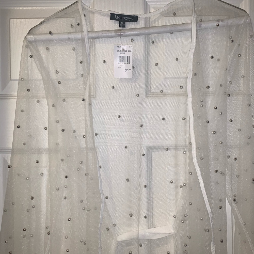 White sheer cardigan with silver studs.